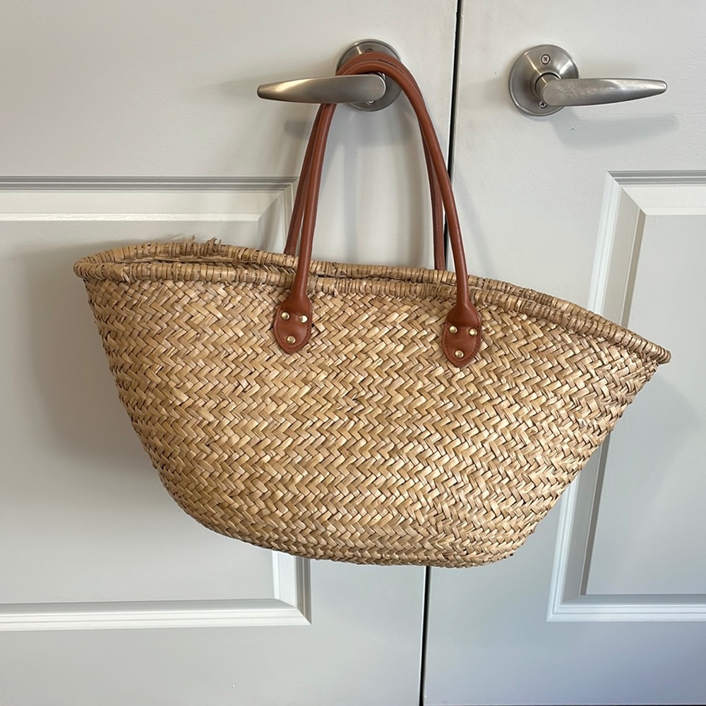 Woven bag with leather handles